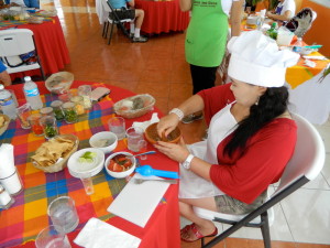 Oyunaa making salsa in the Yucatan